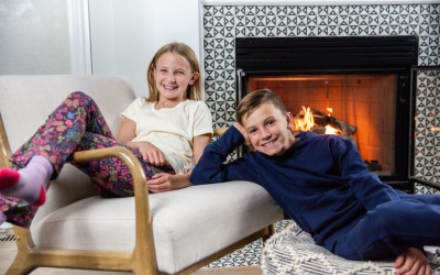 Kids in front of the fireplace for the holidays