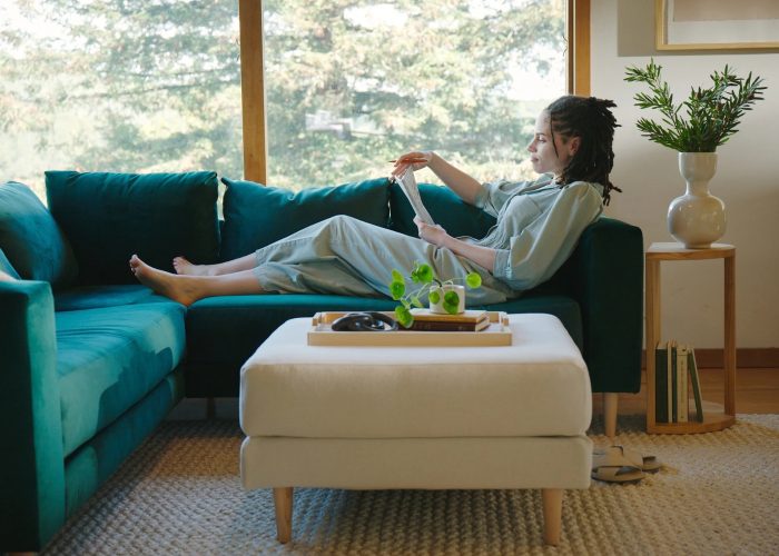 Cream sustainable non-toxic ottoman by sofa